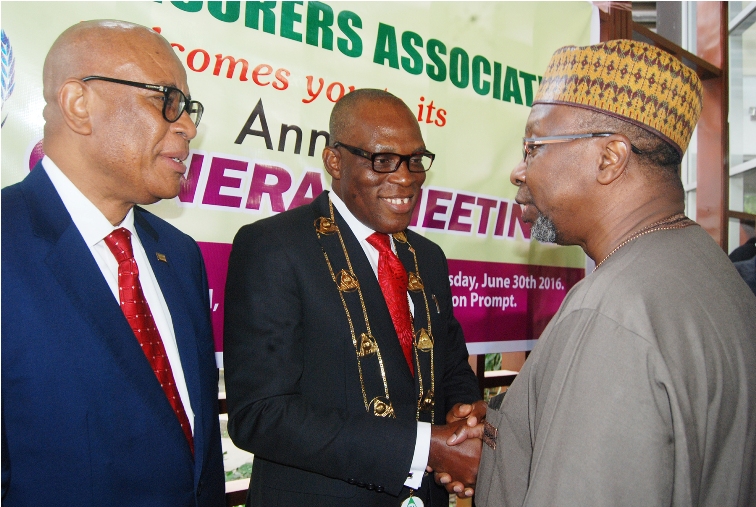 R-l: Commissioner for Insurance, Mr Mohammed Kari, congratulates the Managing Director, Consolidated Hallmark Insurance Plc, Mr Eddie Efekoha, after his investiture as the new Chairman, Nigerian Insurance Association (NIA), during the 45th Annual General Meeting of NIA in Lagos on Thursday. With them is the immediate past chairman, NIA, Mr. Godwin Wiggle. 