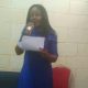 The author, Julie Omeike, at a reading session in Lagos.