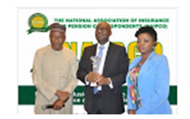 Ken Aghoghovbia, Deputy Managing Director/COO, African Reinsurance Corporation (centre) receiving award of the 2018 NAIPCO Insurance Development Promoter Award from Mohammad Ahmad, Chairman of the NAIPCO 2019 National Conference (left) while Mrs. Omobola Tolu-Kusimo, President of NAIPCO (right) looks on.